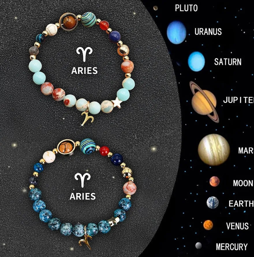Set of two natural stone beaded bracelets with zodiac sign designs on a flat surface.