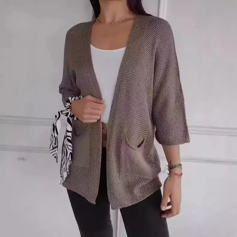 Women's waffle texture cardigan coat with nine-quarter sleeves in army green colour showing side pockets