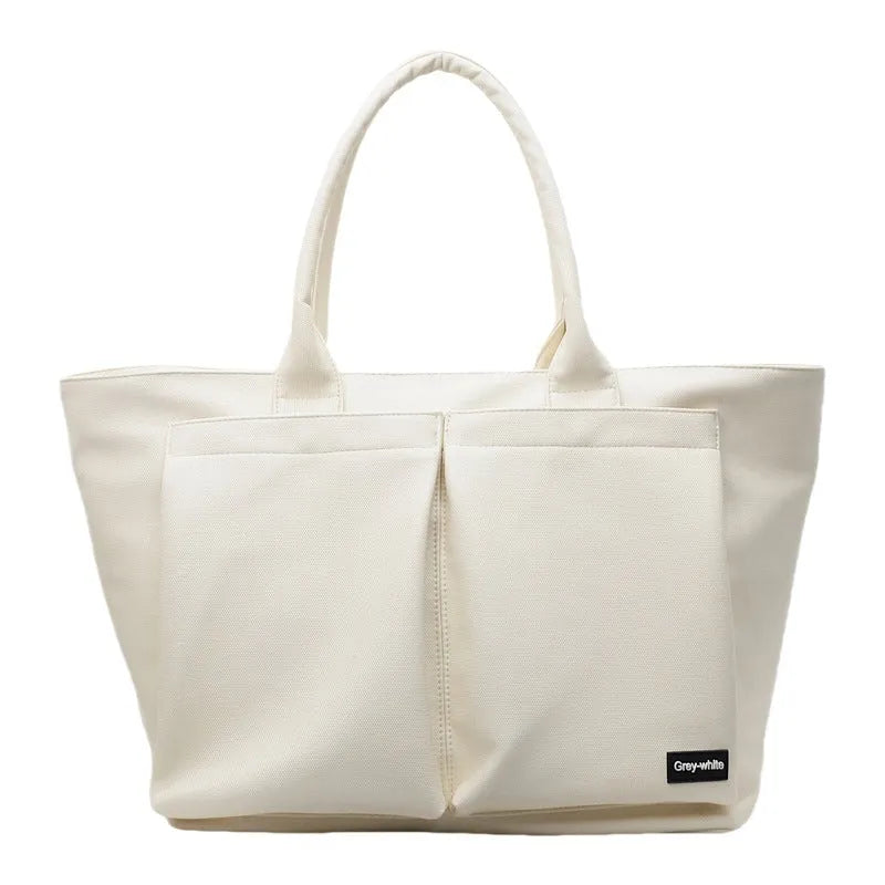 Lightweight PU shoulder bag with expandable 20-35 litre capacity in black, white or green