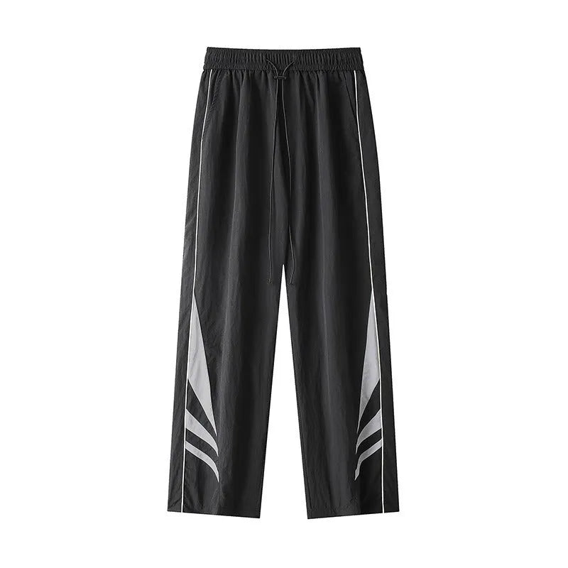 Men's straight-leg grey cotton blend sports trousers with an elasticated waistband laid flat.