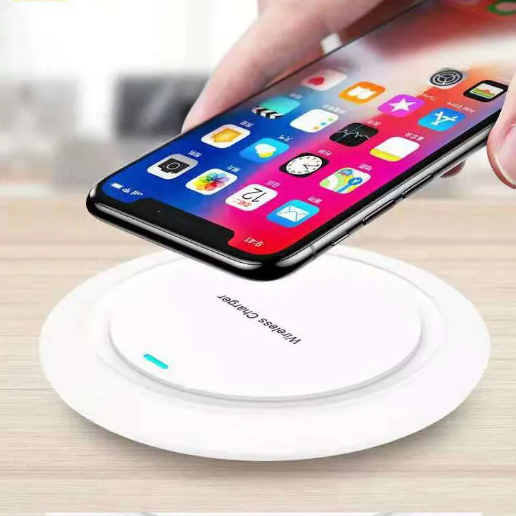 Circular white desktop wireless phone charger showing 10W fast charging capability and 7mm thickness