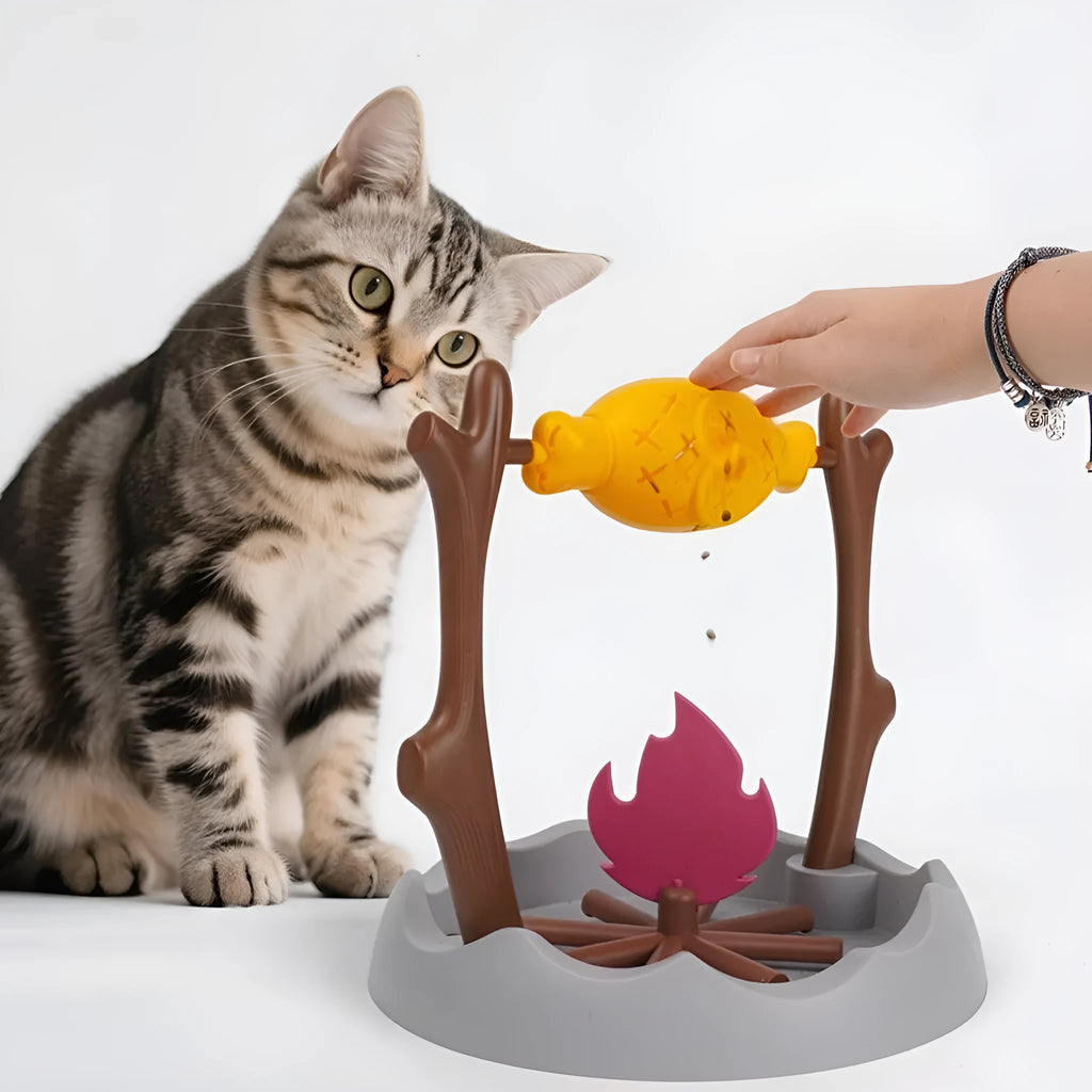 Tumbling barbecue design cat feeder toy with food compartments measuring 30x30x29cm