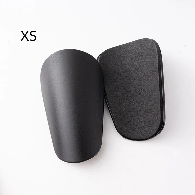 Pair of PU mini football shin guards for sports protection in various colours.