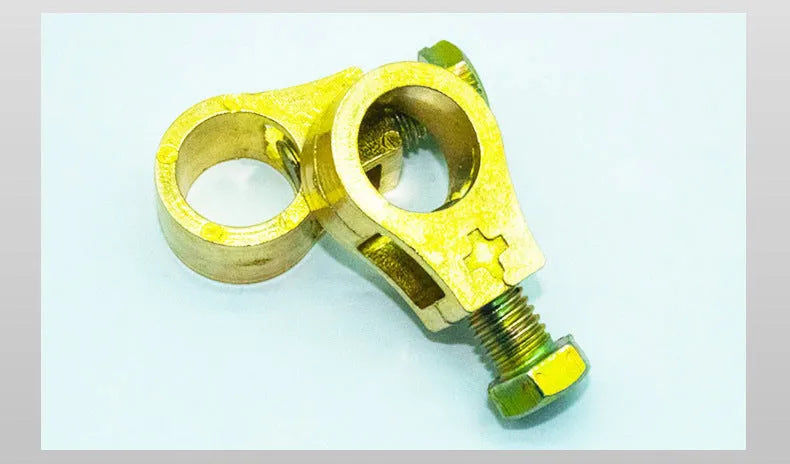 Pure copper car battery terminal clamp or connector on a white background.