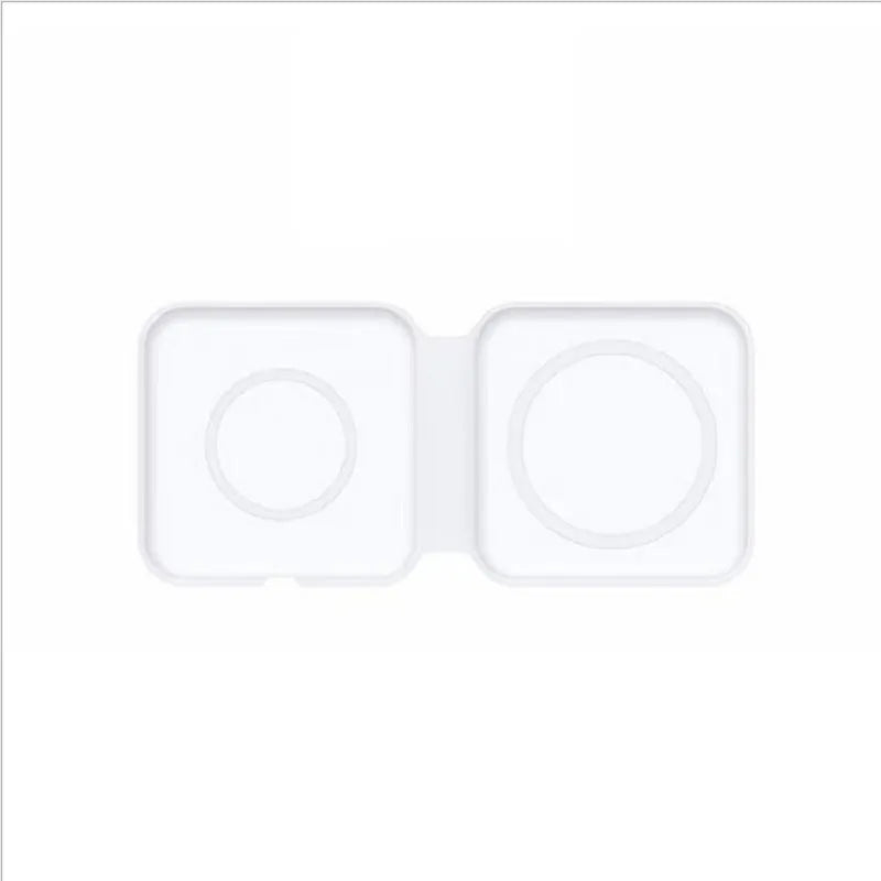 White foldable magnetic wireless charging dock with a phone attached and earbud case on the base.