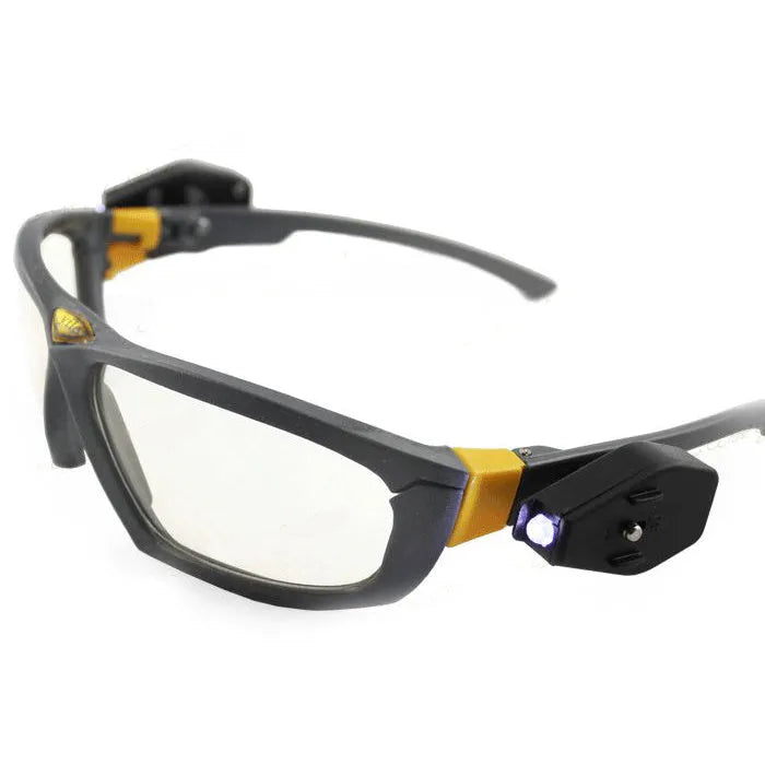 Yile anti impact goggles with LED lamp on a workbench showing protective eyewear and integrated light