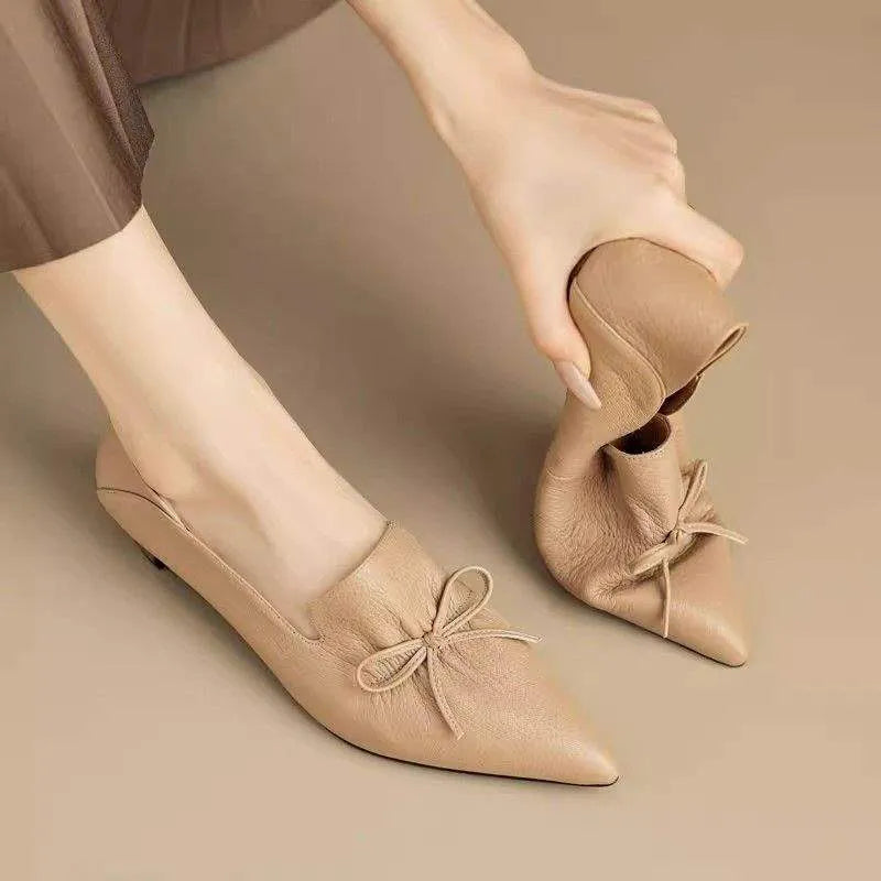 Women's low heel pointed toe shoes in black with PU upper and soft surface finish