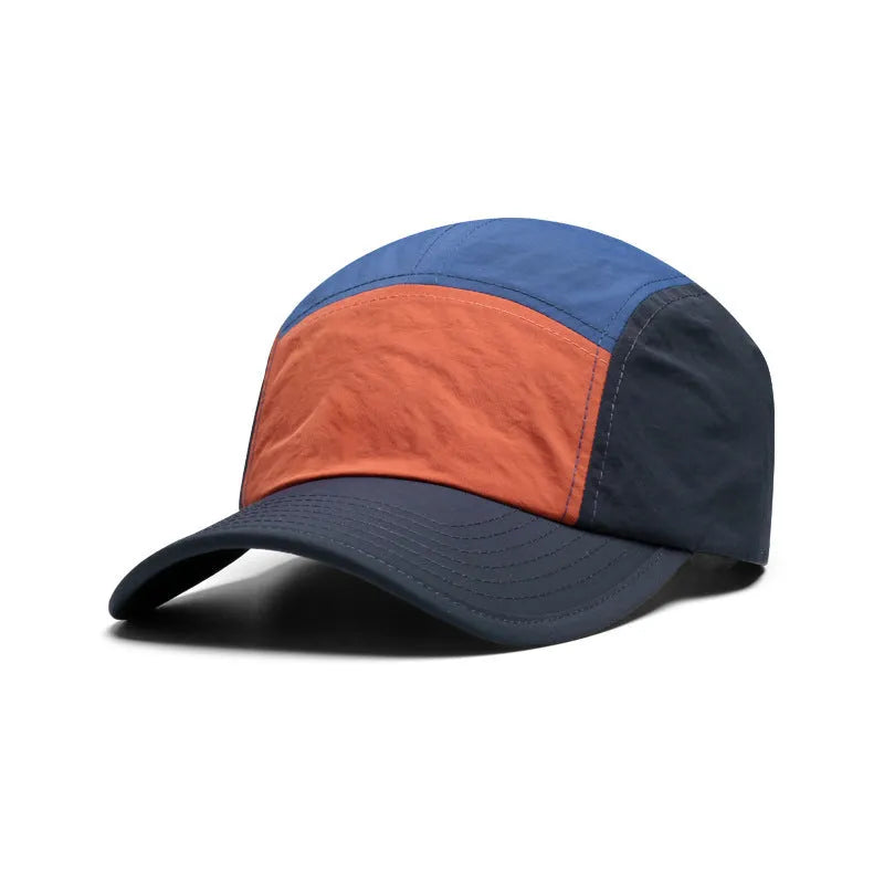 Men's khaki coloured cotton-polyester baseball cap with a curved brim and adjustable back strap on a wooden surface.
