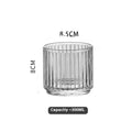 Clear glass whiskey wine glass with striped pattern on modern bar table