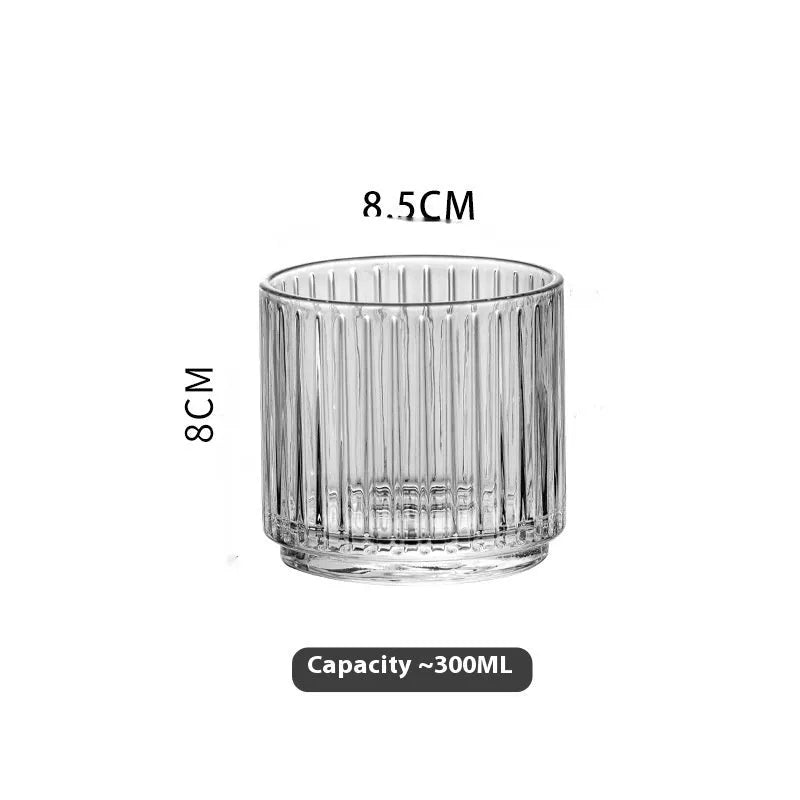 Clear glass whiskey wine glass with striped pattern on modern bar table