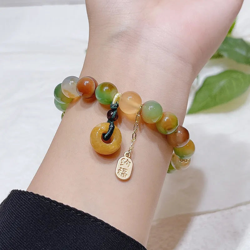 Peacock agate coloured women's bracelet with a peace buckle, made from agate and alloy.