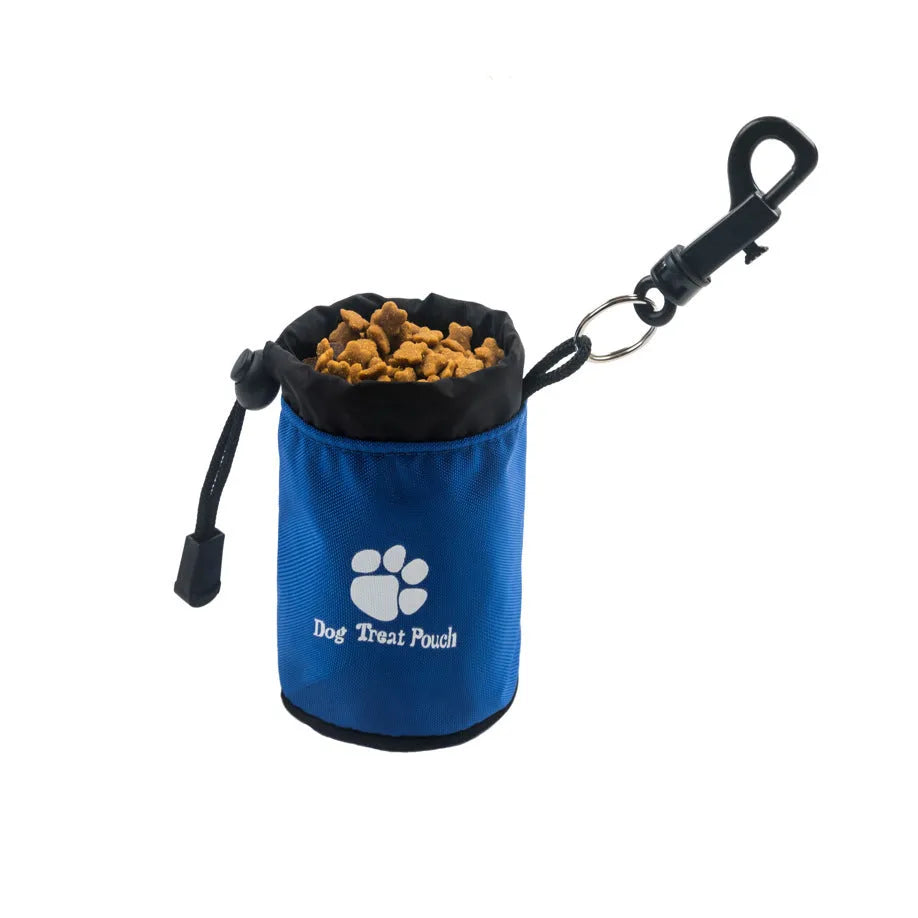 Mini red nylon pet snack bag for dog training treats on a table.