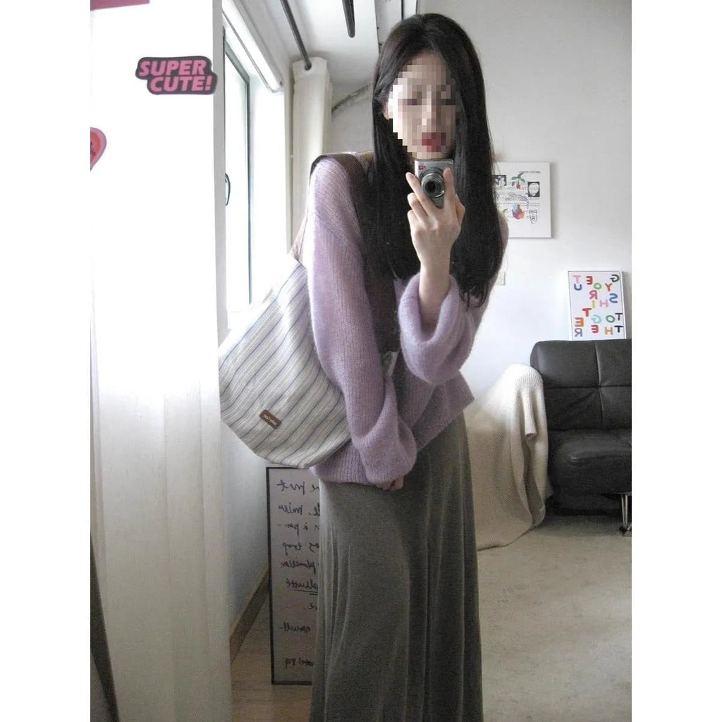 Purple women's Ice Silk blouse with hollow-out princess sleeves on a hanger.
