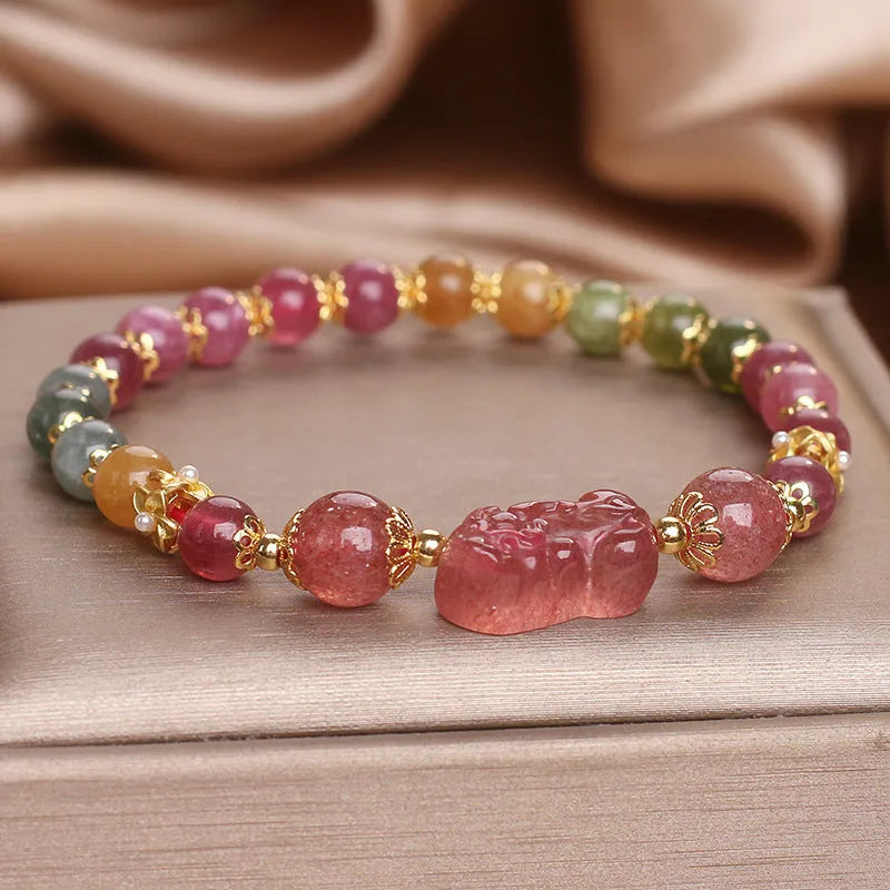 Pink and red candy colour crystal bracelet with tourmaline and strawberry quartz stones, 17 cm length.