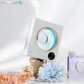 Small white wall-mounted automatic aromatherapy diffuser machine with USB charging port.