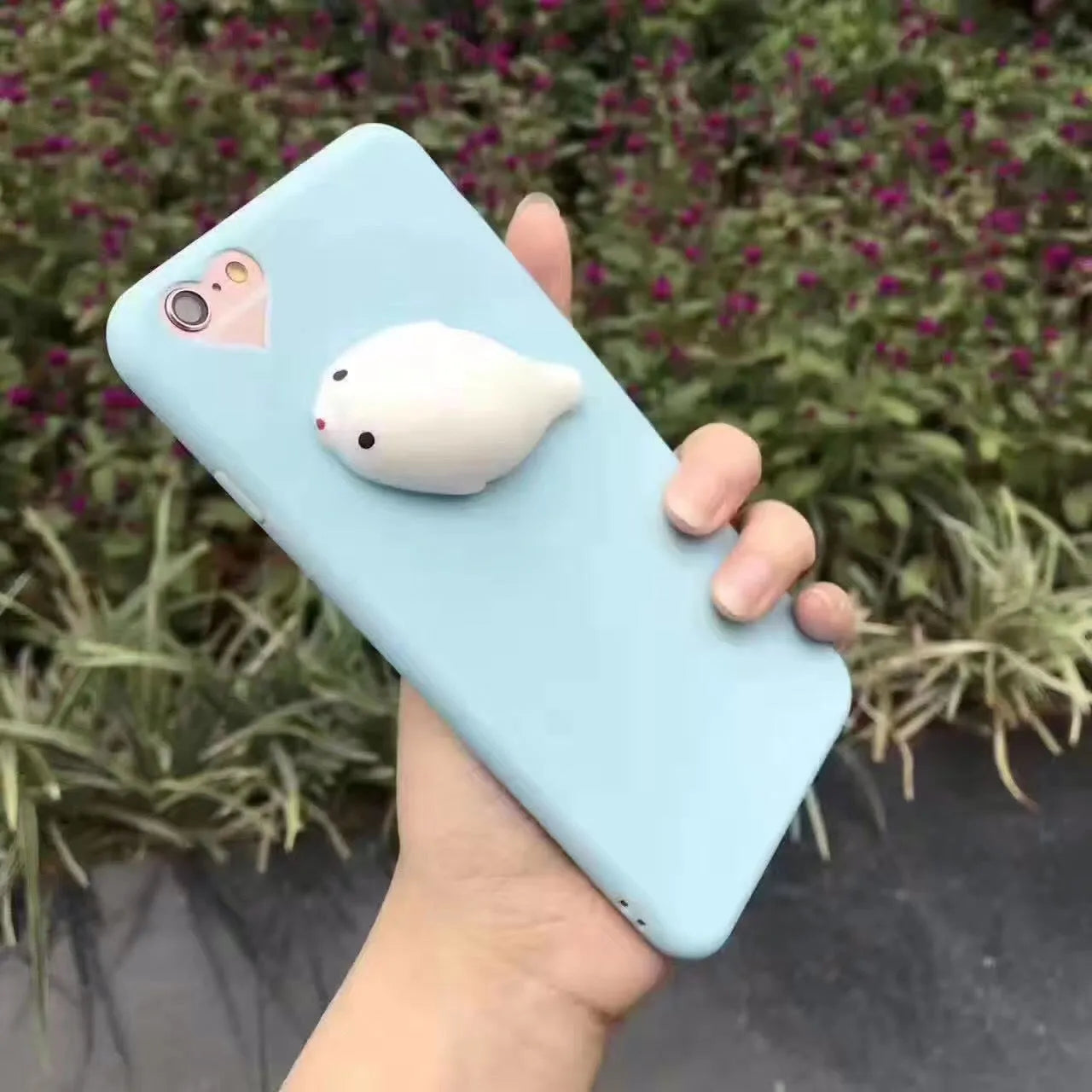 Soft silicone TPU iPhone case with a 3D cartoon cat design, shown in pink.