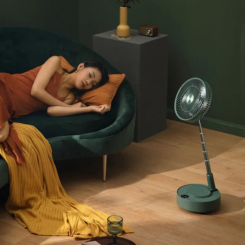 Green telescopic storage floor electric fan shown in both desktop and extended vertical configurations with remote control