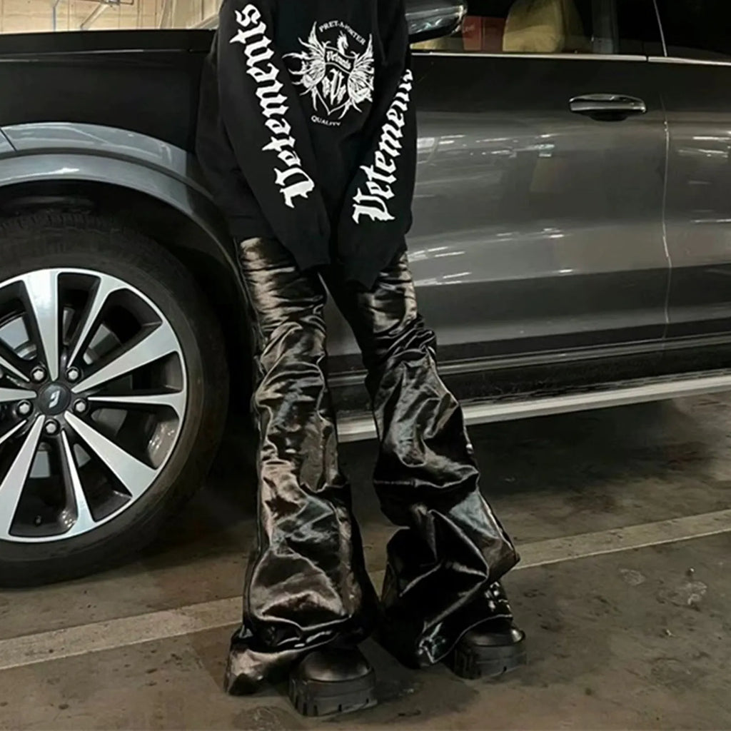 Black coated shiny patent leather skinny jeans with a straight leg and mid waist.