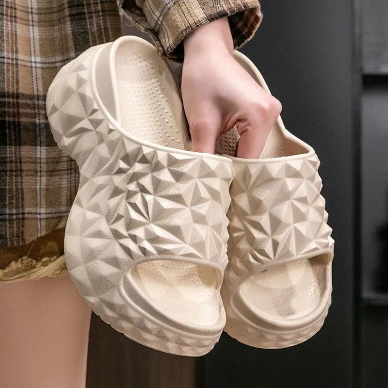 Khaki coloured EVA high heel flip flop slippers with a thick, textured sole.