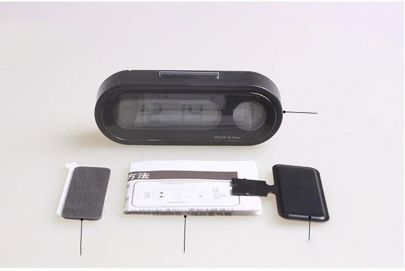 Black electronic car dashboard clock and thermometer with adjustable bracket on display