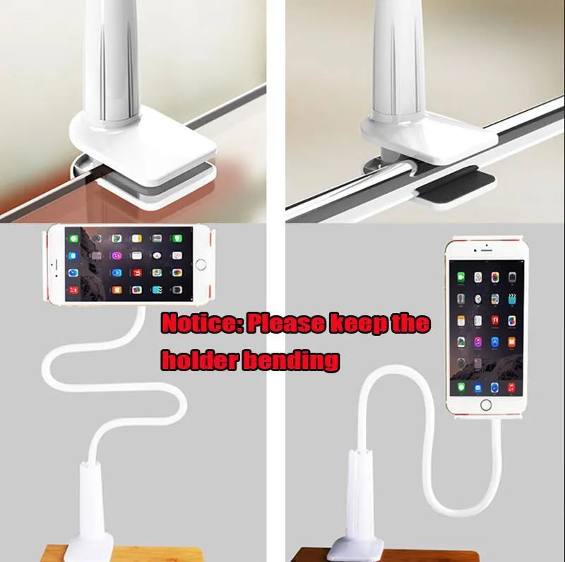 Black bedside oversize phone stand with a long adjustable arm on a wooden table.