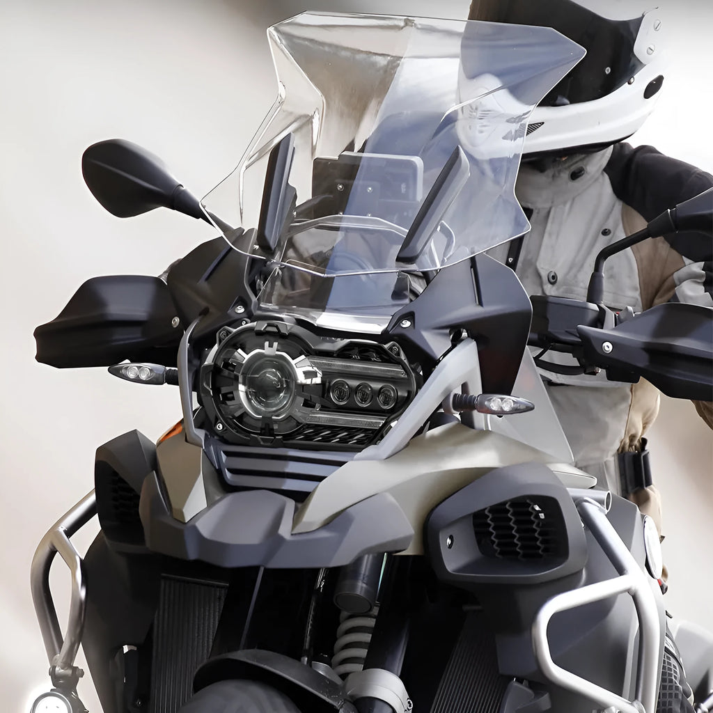 Black background LED motorcycle headlight unit for bike modification, showing polycarbonate lens.