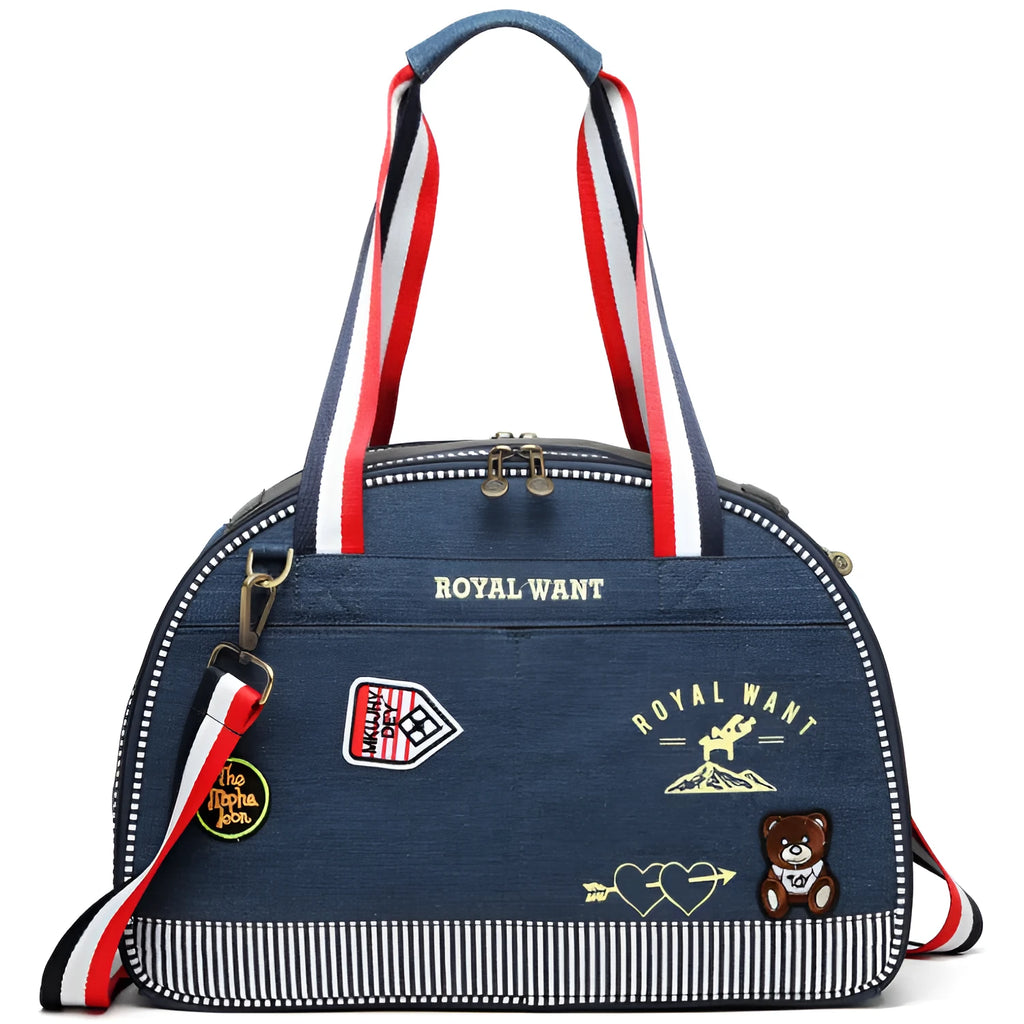 Blue cartoon-patterned denim pet nappy bag with shoulder strap.