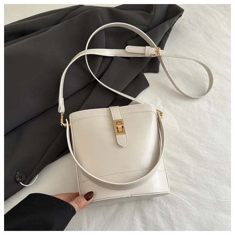 Women's one shoulder crossbody bag bucket shape in PU leather, available in black, brown, khaki, white. Width 19cm height 18.5cm.