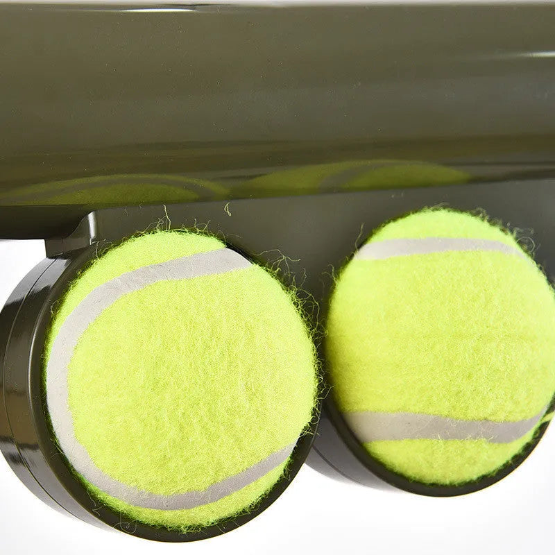 Black tennis ball shooting gun pet toy with automatic ball feeder, 65.5 cm long with two tennis balls