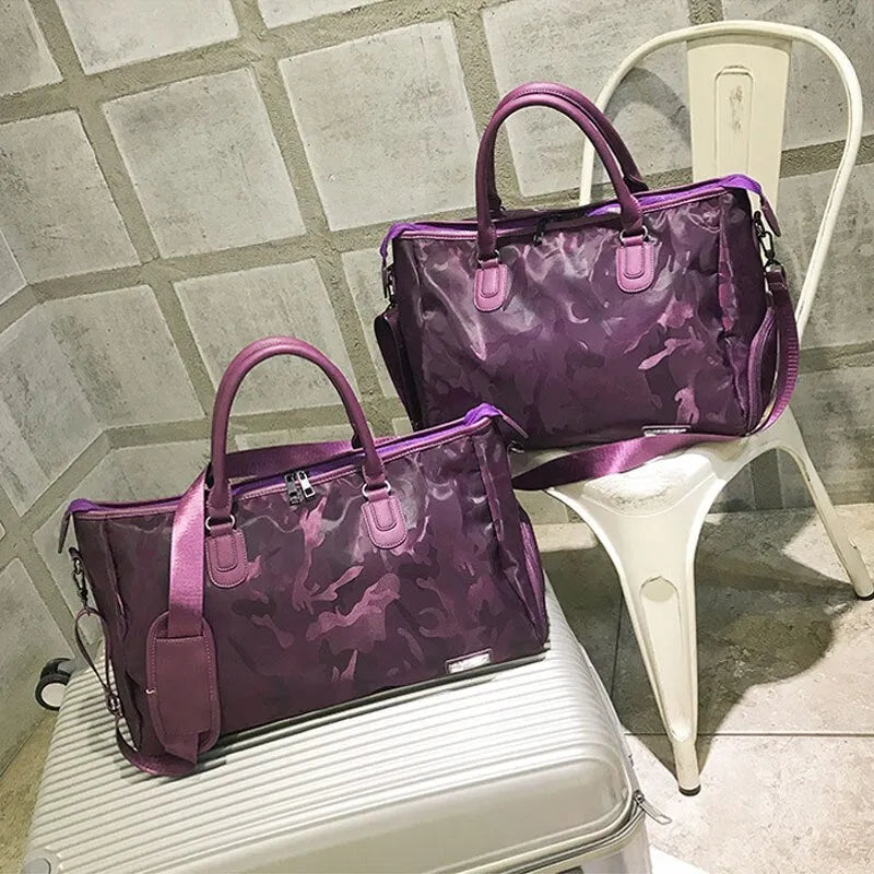 Nylon travel bag in black with soft handle, top zipper, and multiple internal pockets