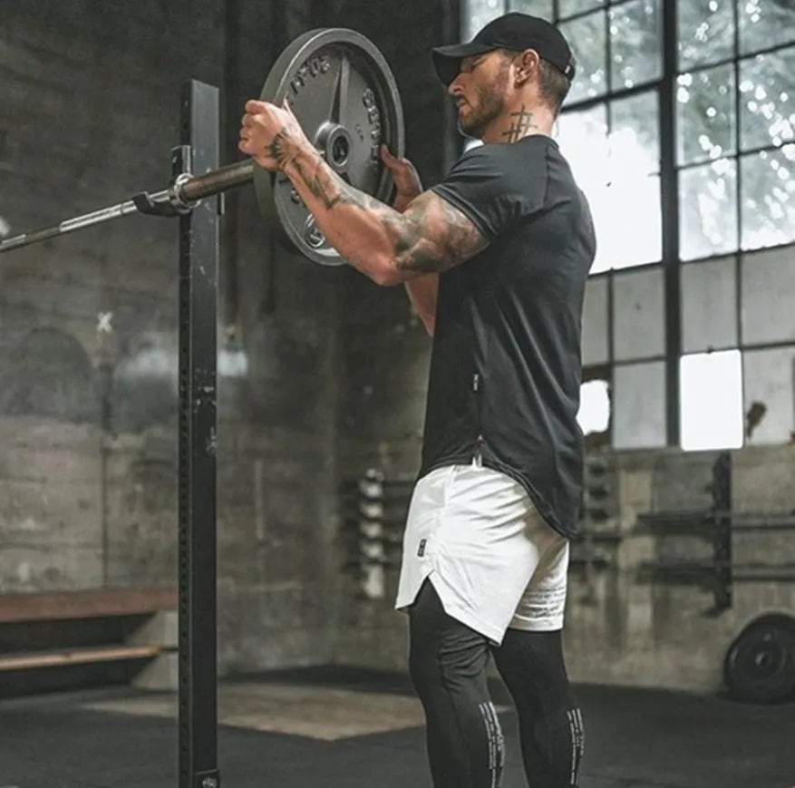 Men's plain gym shirt in cotton-spandex blend fabric showing colour options including army green, black, and white