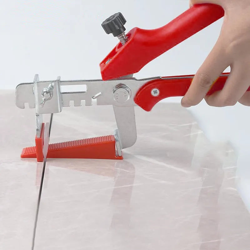 Red PVC and stainless steel tile leveling clip measuring 23 by 11.5 cm for floor tile installation