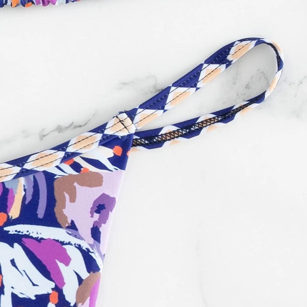 Women's floral print triangle bikini swimsuit with split briefs in polyester fabric