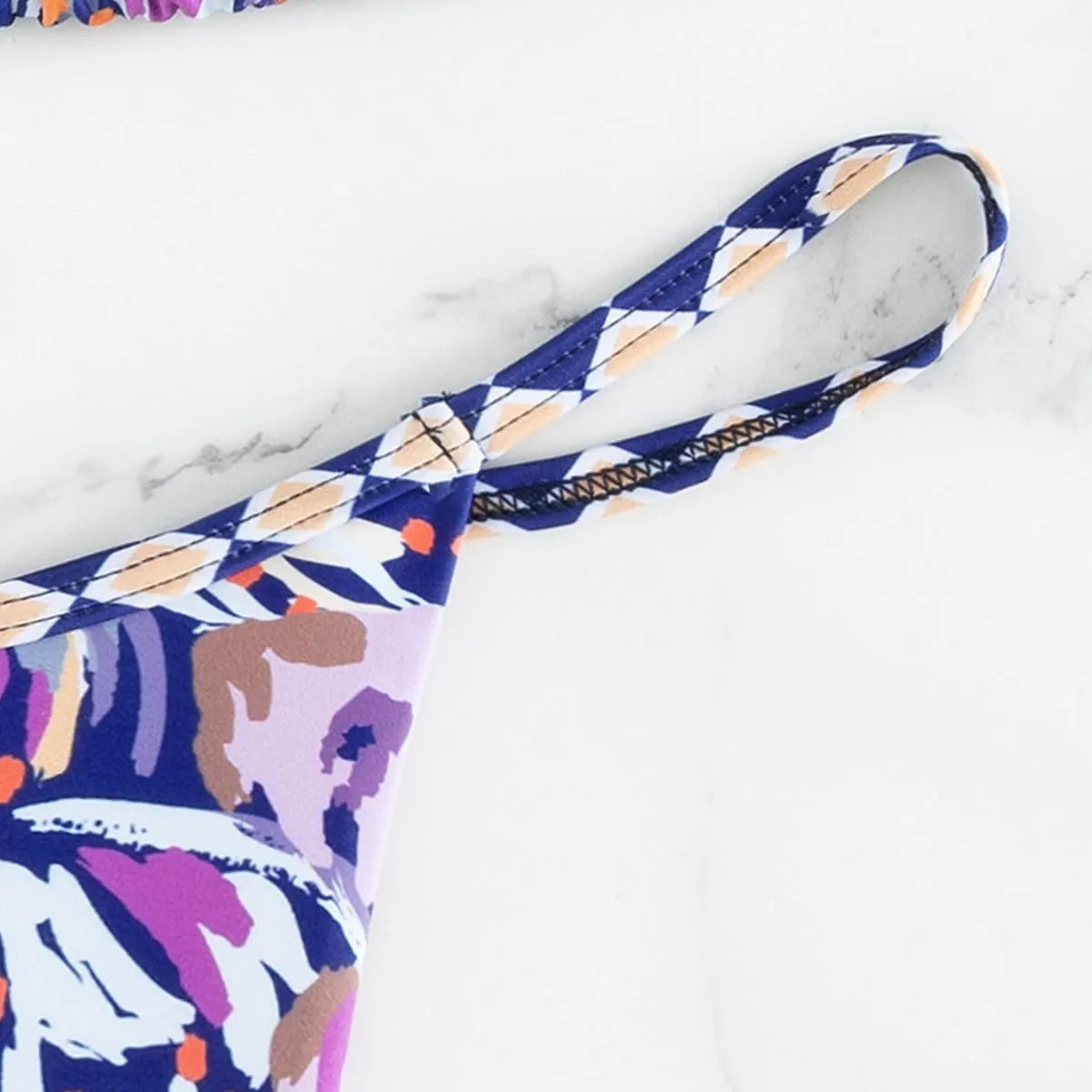 Women's floral print triangle bikini swimsuit with split briefs in polyester fabric