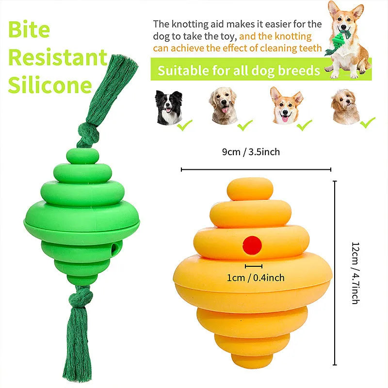 Green and yellow silicone dog ball with knotted rope attached, showing food dispenser openings.