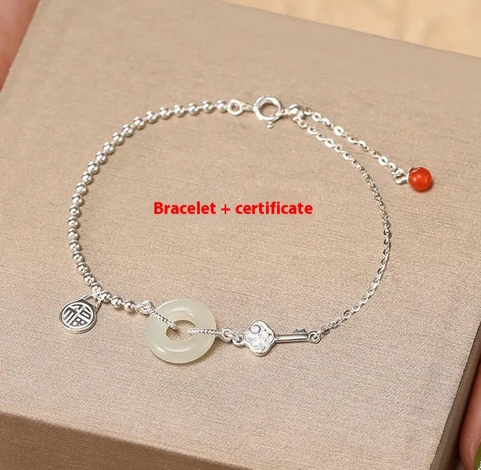 925 silver Hetian jade bracelet geometric peace buckle design on woman's wrist
