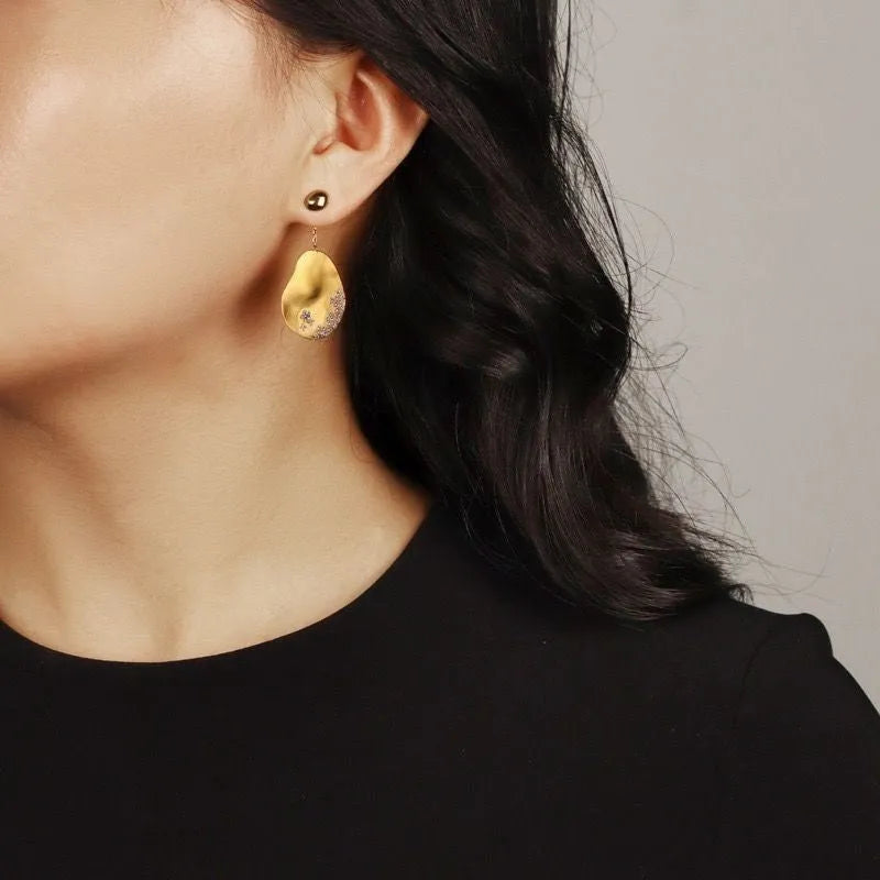 Asymmetric floral earrings with Chinese style design featuring zircon mosaic accents on gold-plated materials