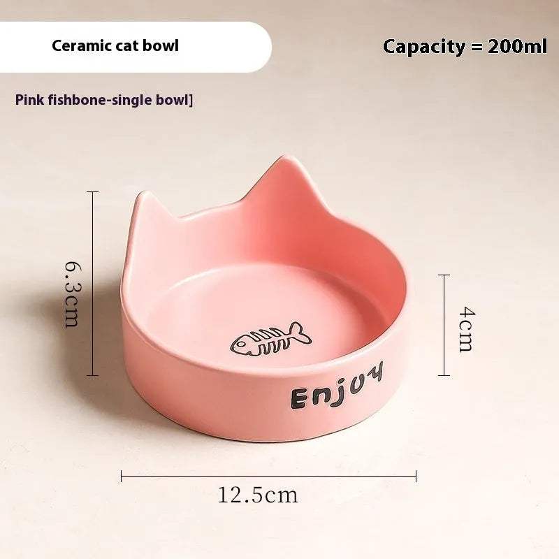 Porcelain cat bowl with cat ear and paw design on a wooden feeding frame, in pink colour.