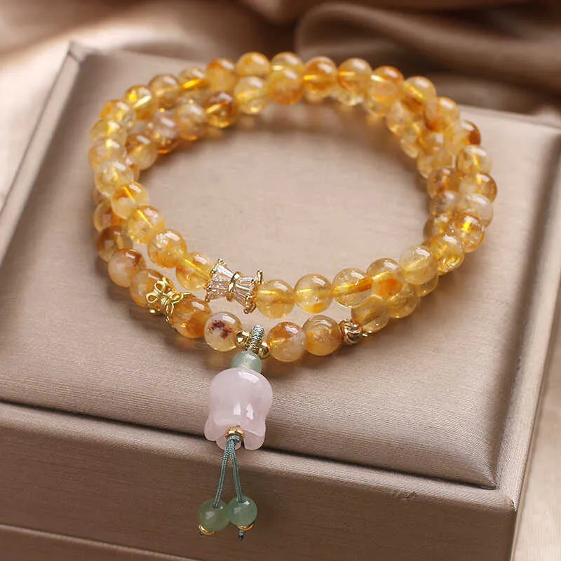 Women's crystal bracelet with natural gold rutilated quartz yellow tower double ring Lily pendant, pearl and rhinestone accents, 34cm length