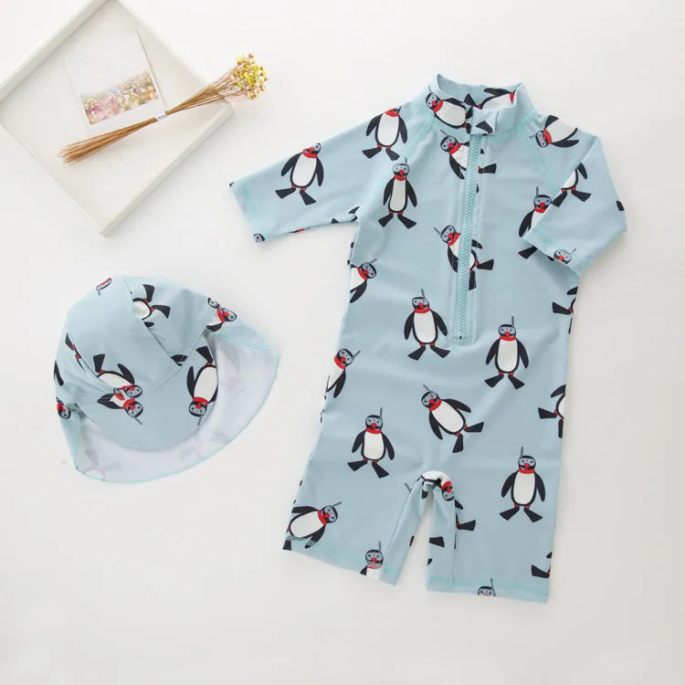 Boys' penguin print two-piece swim set with long sleeve rash guard top and matching swimming cap