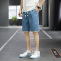 Man wearing loose-fit khaki casual shorts in a South Korean style.