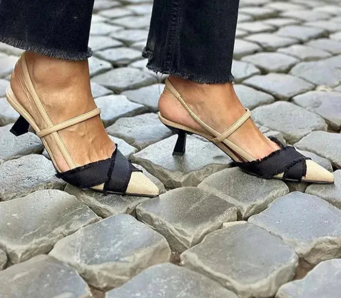 Women's apricot and black colour block stiletto heel sandals with pointed toe and buckle strap.