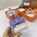 Women's fashion car key case in artificial leather showing crocodile print and palm print pattern options.
