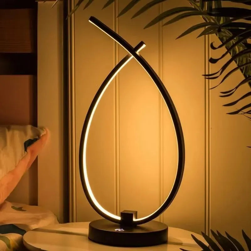 Water drop shaped table lamp in black or white with warm light and USB power