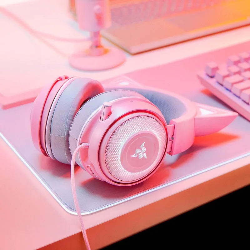 Pink glowing cat earphones with wired USB connection and LED lights on a head-mounted frame
