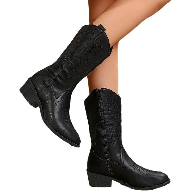 Women's black mid-calf Martin boots with chunky heel, pointed toe, and hollow out detailing