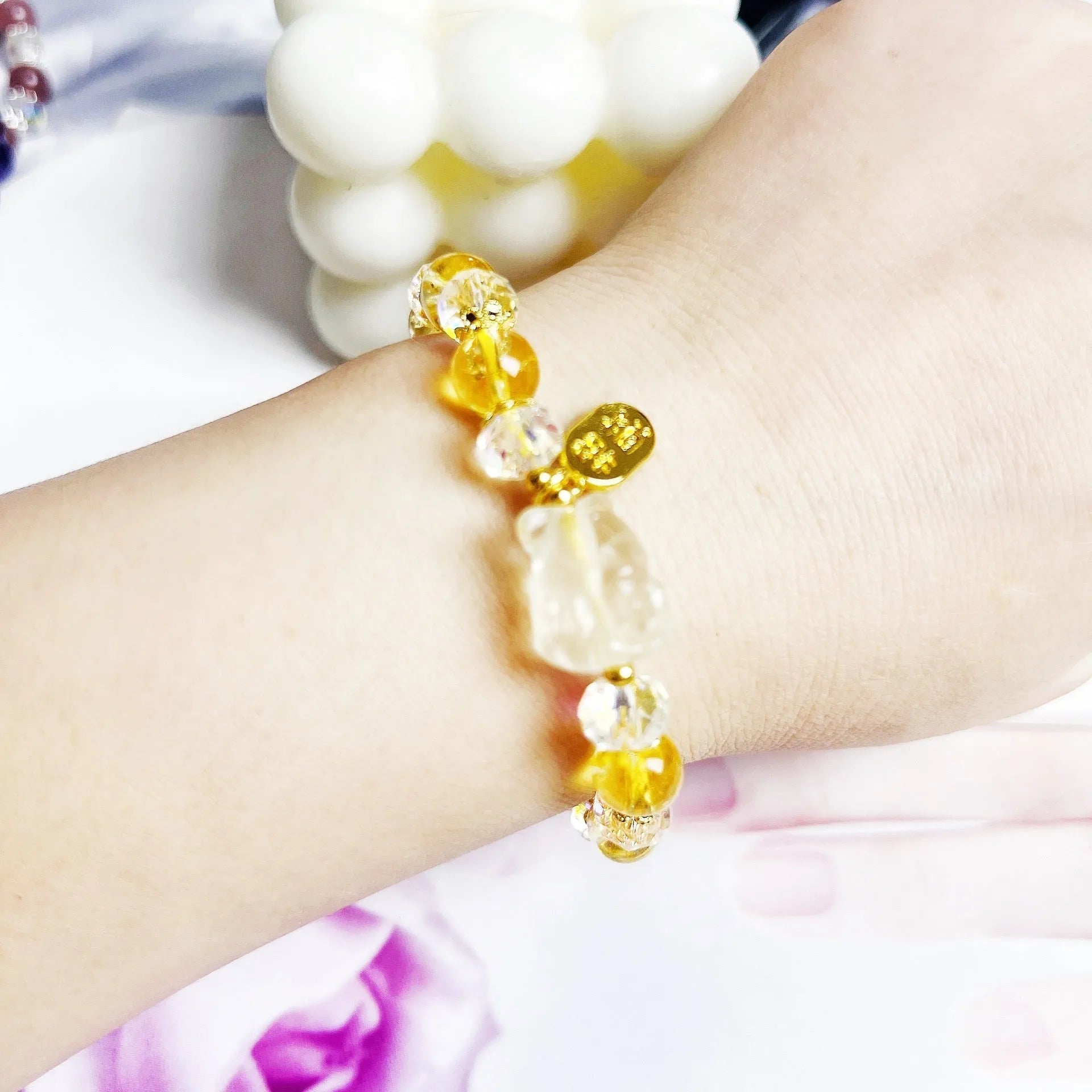 Handmade citrine crystal bracelet with a detailed nine-tail fox charm on a gold-toned chain.