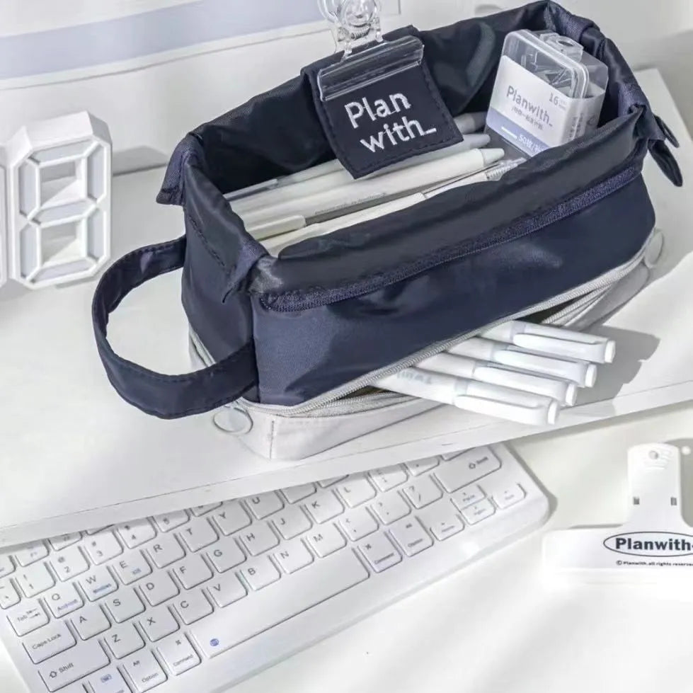 A dark blue folding double-layer pencil case for school stationery.