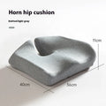 Black memory foam office chair cushion with a mesh lining, shown on a grey office chair seat.