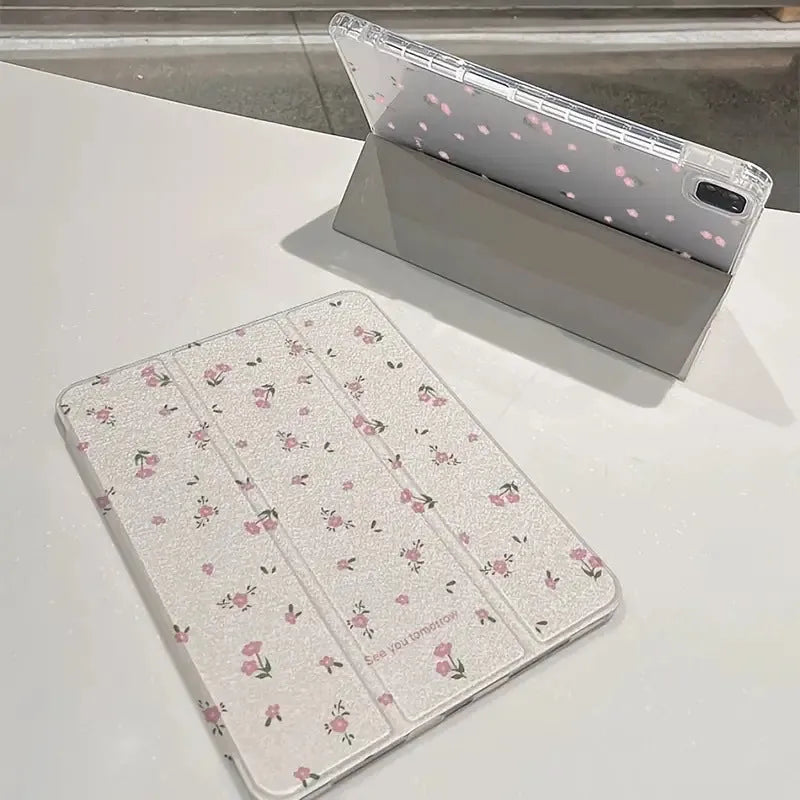 Transparent floral patterned iPad case showing three-fold magnetic stand positions